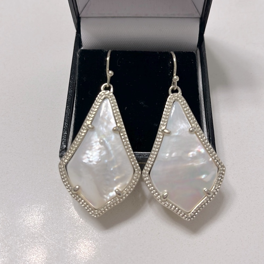 Kendra Scott drop earrings in Opal with silver border.